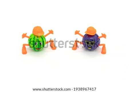 Plastic watermelon toy isolated white.