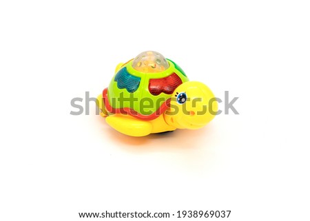 Plastic turtle toy isolated white.