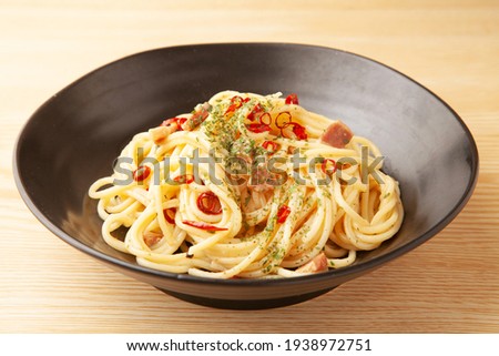 Peperoncino spaghetti on a plate Royalty-Free Stock Photo #1938972751