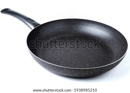 Brand new frying pan with non-stick coating isolated on white.