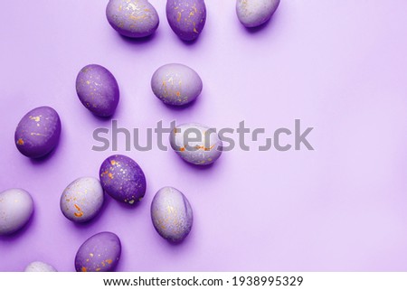 Easter frame of eggs painted in purple color.