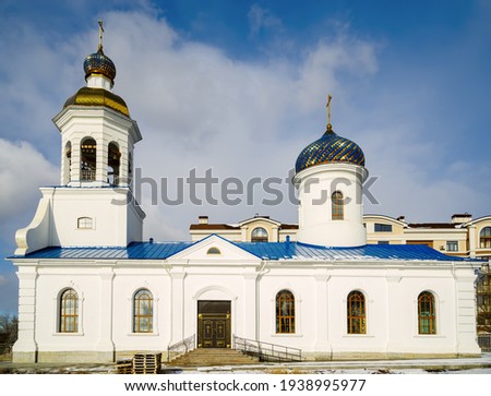 The restored Vvedenskaya church on the banks of the Urals in winter. The picture was taken in Russia, in the city of Orenburg
