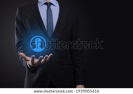 Businessman in suit holding out hand icon of user. Internet icons interface foreground. global network media concept,contact on virtual screens ,copy space.