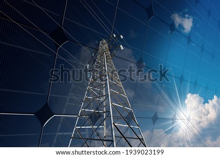 Close-up of a high voltage tower, power line, on a solar panel with blue sky, clouds and sun rays. Solar and renewable energy concept.