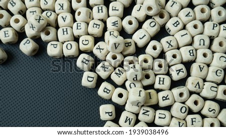 alphabet wood cube on black background  for  education concept