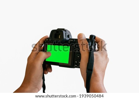 Hand holding a camera that is about to take a picture On a white background