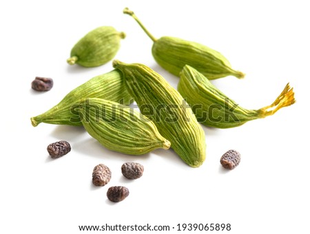Cardamom pods and seeds isolated on white background Royalty-Free Stock Photo #1939065898