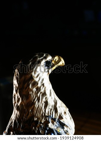 statuette of an eagle on the background
