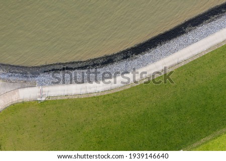 View from above of the flood dam near Hooksiel. Hooksiel is a holiday resort in East Frisia and is located on the North Sea coast in Germany.