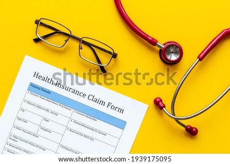 Health insuranse claim form, top view. Medical care concept.