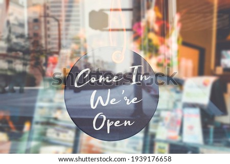 Tag Sign board of Come in We're Open  hang on door or window of business shop 