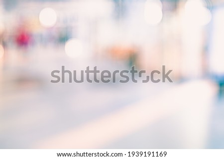 BLURRED OFFICE BACKGROUND, LIGHT BUSINESS HALL WITH BOKEH LIGHTS AND WINDOW REFLECTIONS