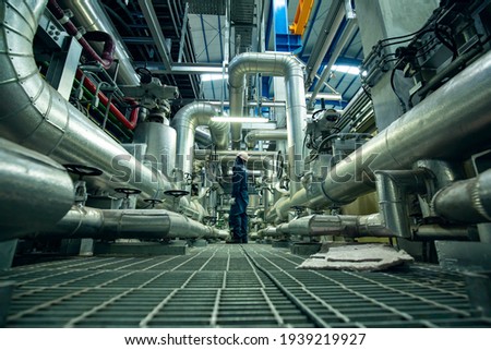 Male to be worker visual inspection inside control room valve and pipeline power plants Royalty-Free Stock Photo #1939219927