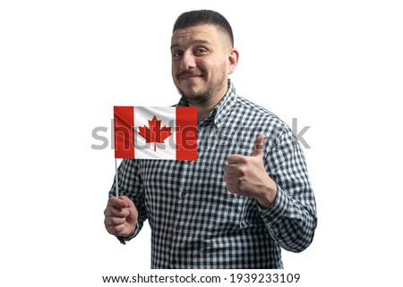 White guy holding a flag of Canada and shows the class by hand isolated on a white background. Like for Canada.