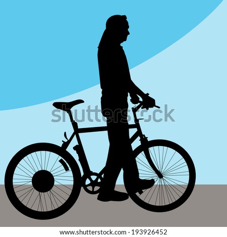 An image of a man walking his bicycle.