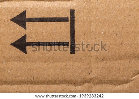 Plain Brown Cardboard with Arrows Background