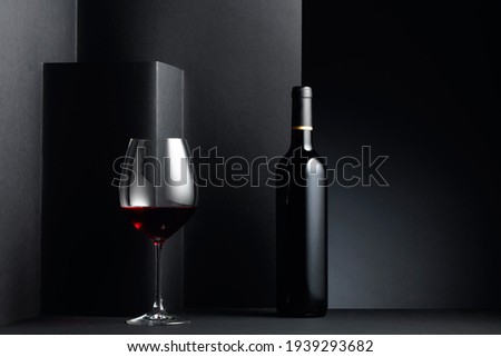 Red wine on a black background. Copy space.