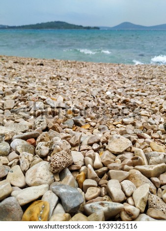 Pebbles of different sizes and shapes on the beach of the Adriatic sea