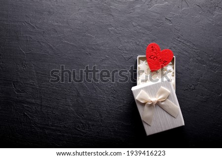 Beautiful valentines day background with red hearts on black background. Card for Valentine's Day. Love concept.