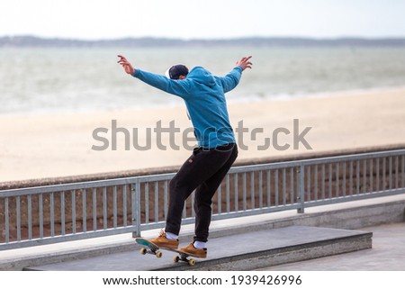 young man skateboarding in a skatepark