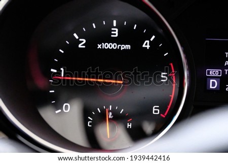 Closeup picture of a cars odometer.