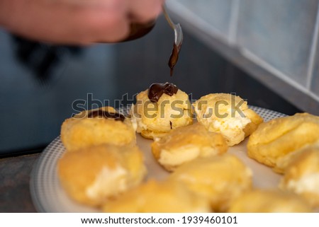 Baking chocolate icing profiteroles at home during COVID-19 lockdown Gold Coast Queensland Australia
