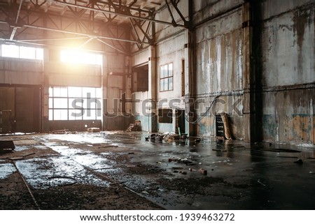 Old broken empty abandoned industrial building interior. Royalty-Free Stock Photo #1939463272