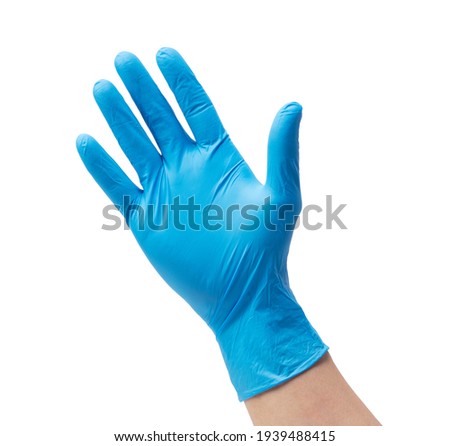 Man's hand wearing nitrile gloves on white background Royalty-Free Stock Photo #1939488415