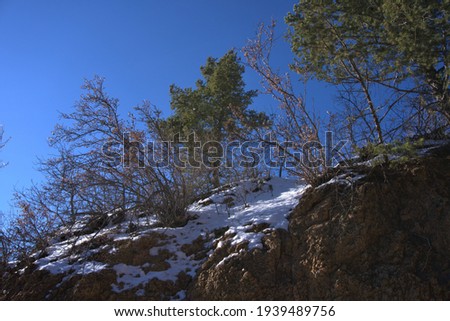 This is a landscape picture of the surrounding mountains from another mountain peak.