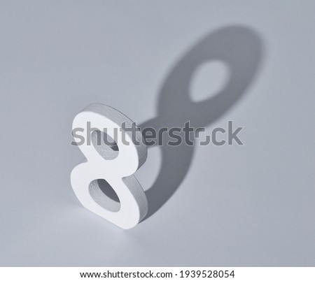 Number 8 with a shadow isolated on a white background. Idea for March 8.