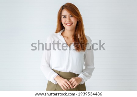 Portrait face of beautiful attractive smile young adult Asian woman in positive pose looking at the camera with happy in studio against white background. Businesswoman or entrepreneur girl concept. Royalty-Free Stock Photo #1939534486