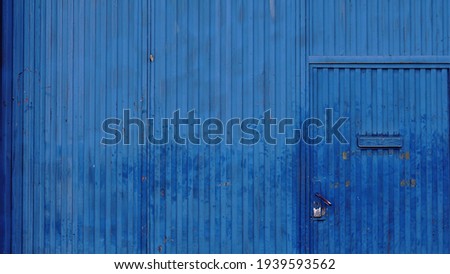 industrial worn blue metal door background
