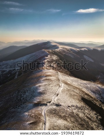 Over the mountains; beautiful landscape with the peaks of romanian Carpathians