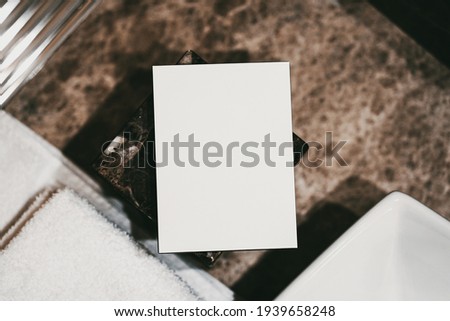 White empty boxes in a hotel bathroom. Modern interior in marble in brown tones