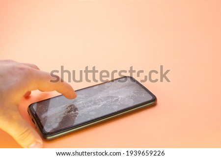 smartphone screen broken glass human hand 