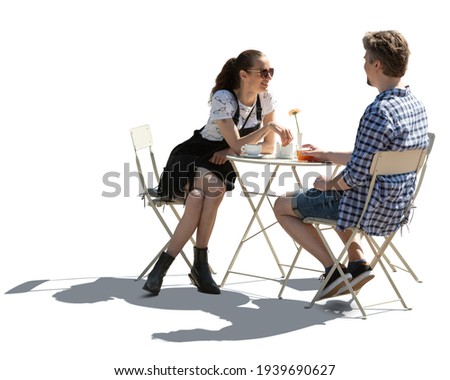 Man and woman sitting in a street cafe and talking, backlit image isolated on white background Royalty-Free Stock Photo #1939690627