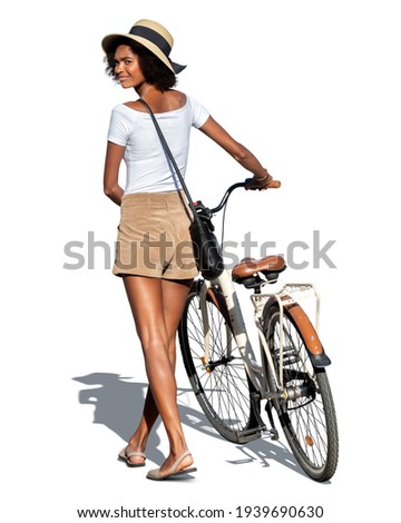 Young black woman walking with a white city bike and looking back over her shoulder isolated on white background Royalty-Free Stock Photo #1939690630