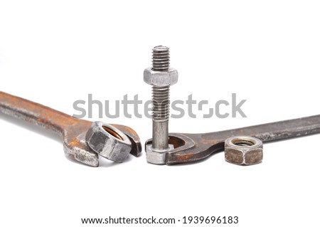 Rusty wrenches, bolts and nuts on white background close up. Tool, old, rare, vintage, macro, DIY