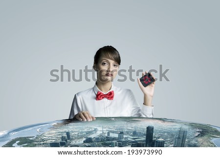 Young woman holding card with recycle symbol