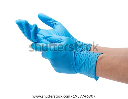 Two hands of a man wearing nitrile gloves on a white background Royalty-Free Stock Photo #1939746907