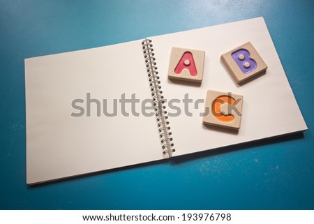 Colorful alphabet letters ,"abc" on the book
