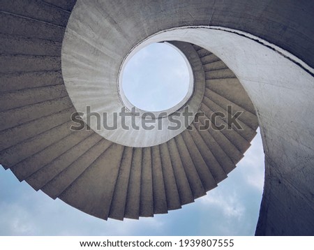 Brutalist spiral staircase with a view of the sky located in Warsaw, Poland Royalty-Free Stock Photo #1939807555