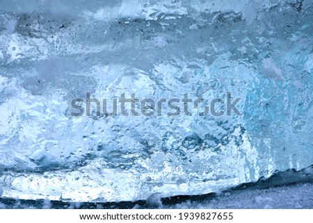 the texture of ice with snow in winter on the street