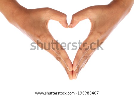 Woman hand making heart sign against white background