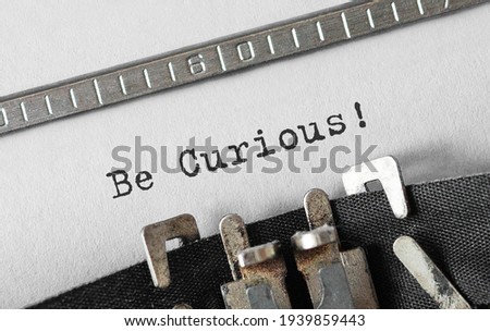 Text Be Curious typed on retro typewriter Royalty-Free Stock Photo #1939859443