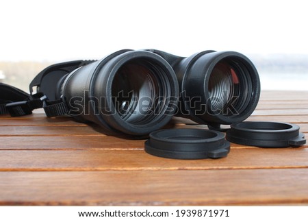 Front facing lenses of birdwatching binocular . Selective focus. Shallow depth of field Royalty-Free Stock Photo #1939871971