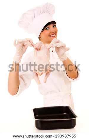 young beautiful female chef presenting raw chicken, white background