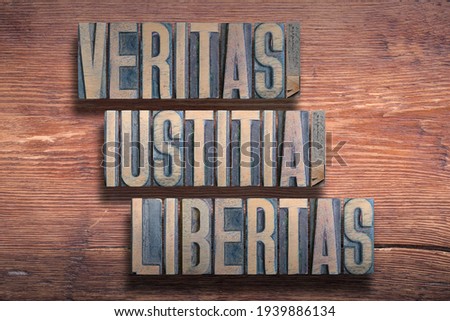 veritas, iustitia, libertas ancient Latin saying meaning - truth, justice, liberty, combined on vintage varnished wooden surface

 Royalty-Free Stock Photo #1939886134