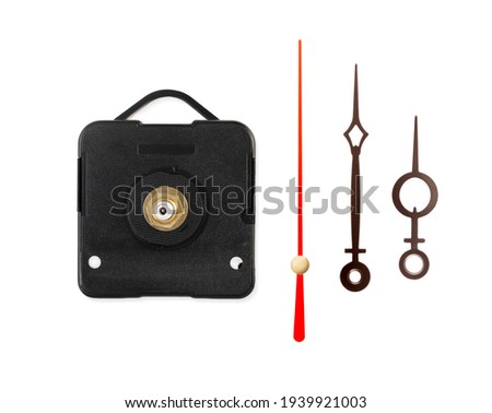 clock mechanism and hour hands isolated on a white background. Close up. Top view. Royalty-Free Stock Photo #1939921003