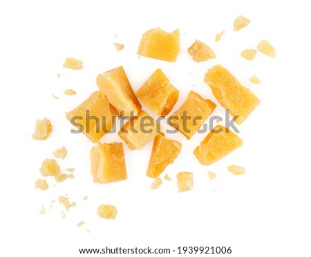 Heap of hard cheese parmesan isolated on a white background. Close up. Top view. Royalty-Free Stock Photo #1939921006